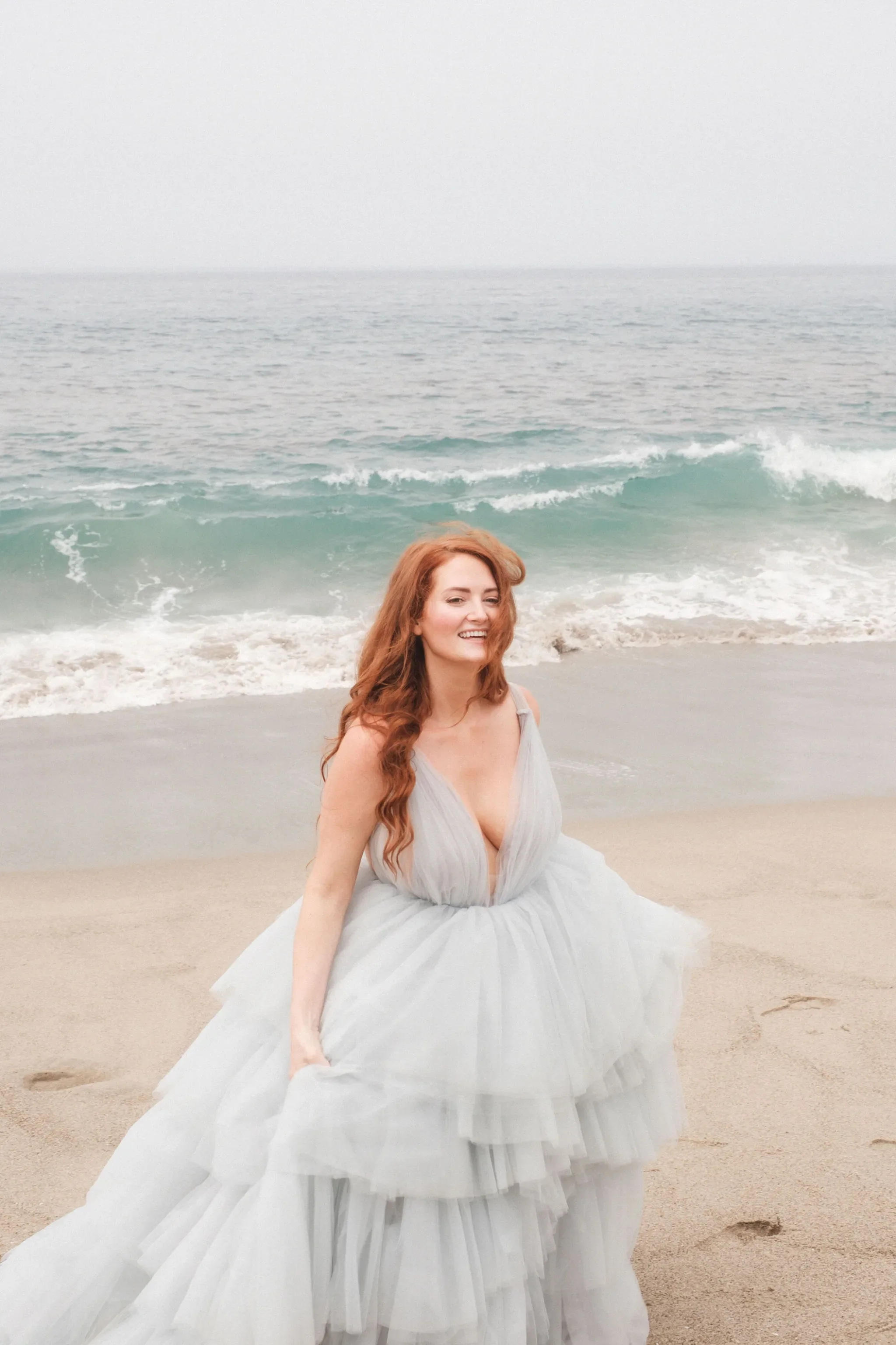 bride in blue wedding dress with beachy bridal hairstyle