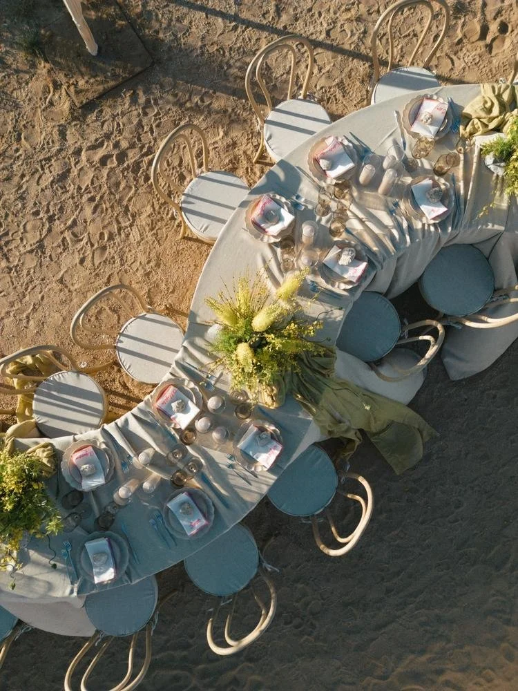 aerial view of curved tablescape at joshua tree wedding in the desert