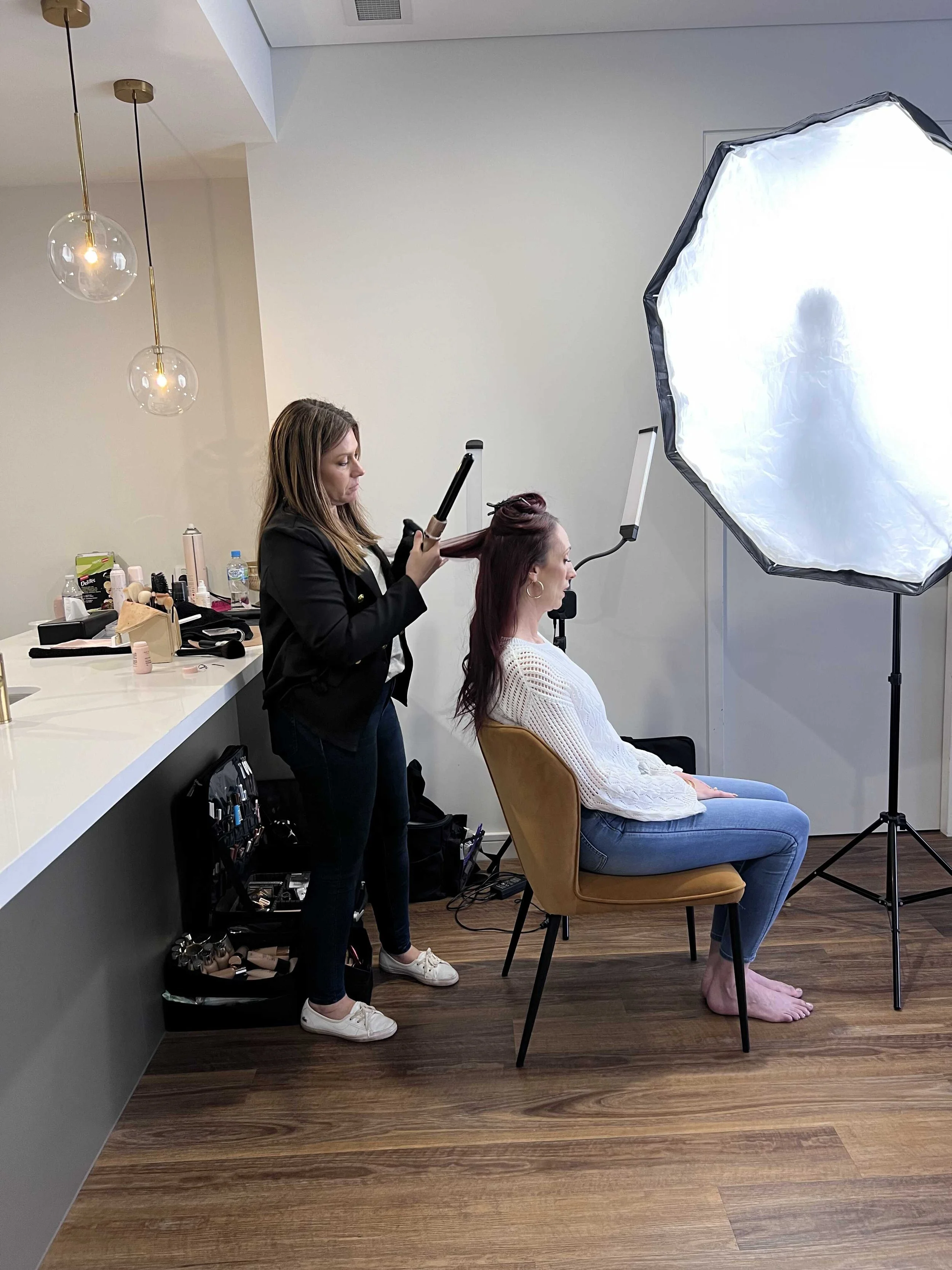 Makeup artist on set at a Penrith brand photoshoot