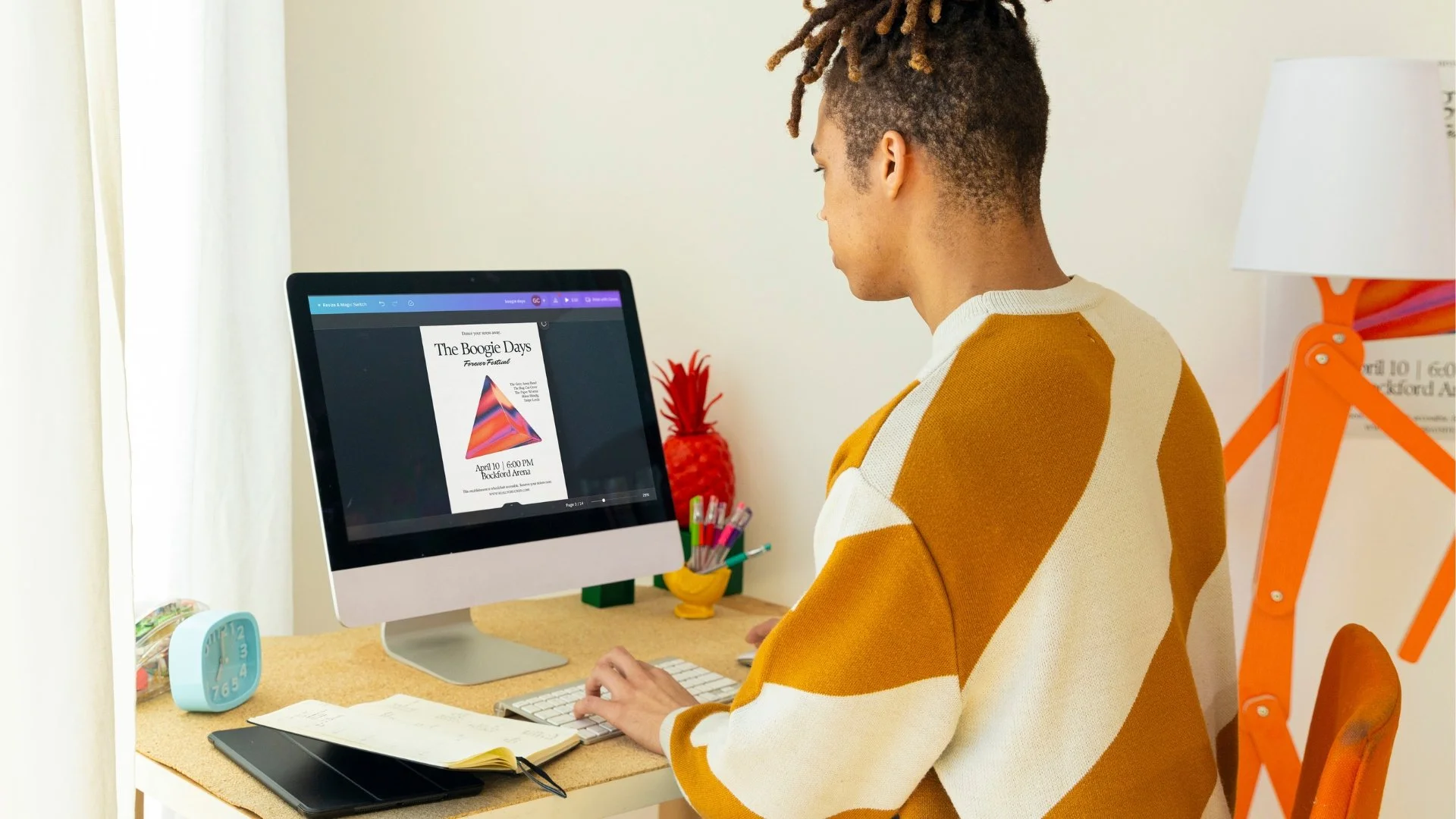 Business owner taking a DIY brand design class, with a flyer showing on the computer screen.