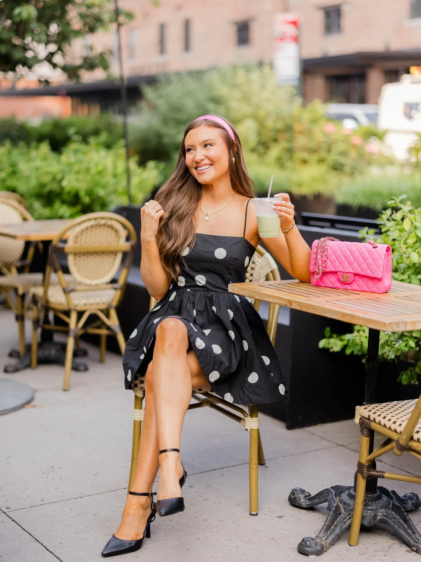 Matcha mornings &amp; city daydreams🍵🌸
&bull;
Sometimes the best days are the simple ones. Sitting outside with a little drink (that I stole from Shelly for this photo🤪), a pink bag, and sunshine on your shoulders🩷

Comment SHOP below to receive 