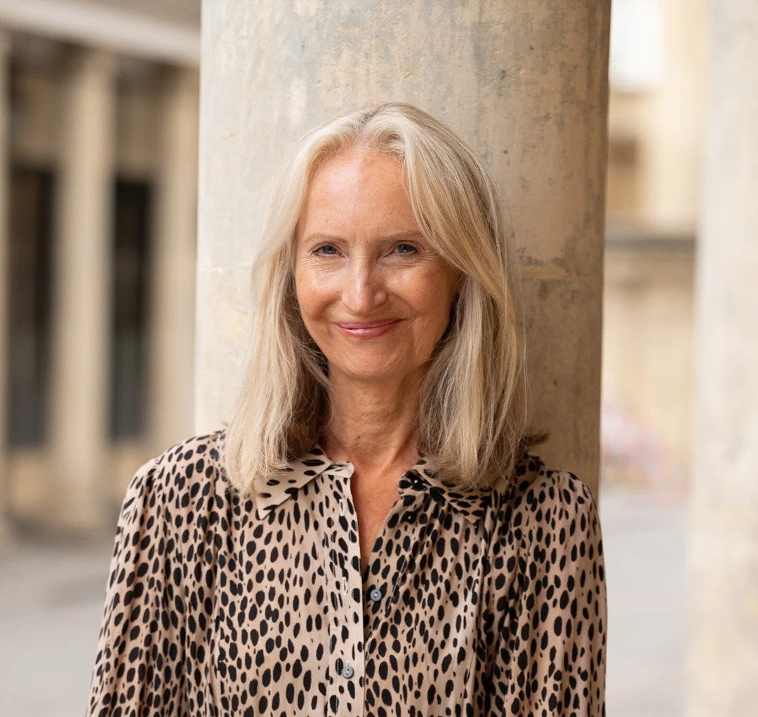 Julie stood outside in Bath smiling
