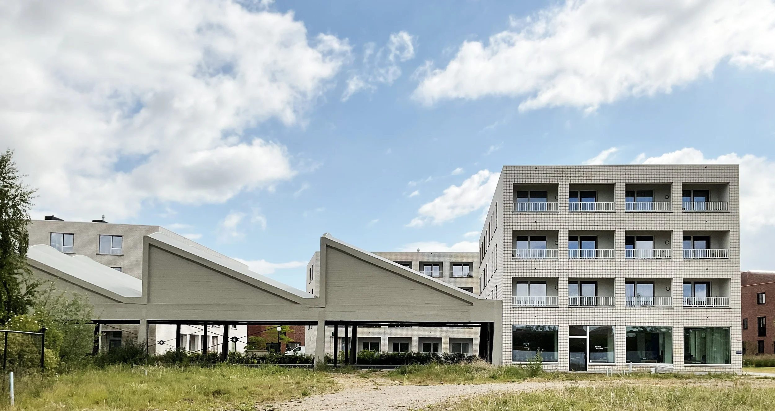 adaptive reuse of the old sheds as a covered public area integrated with the elderly assisted-living facilities