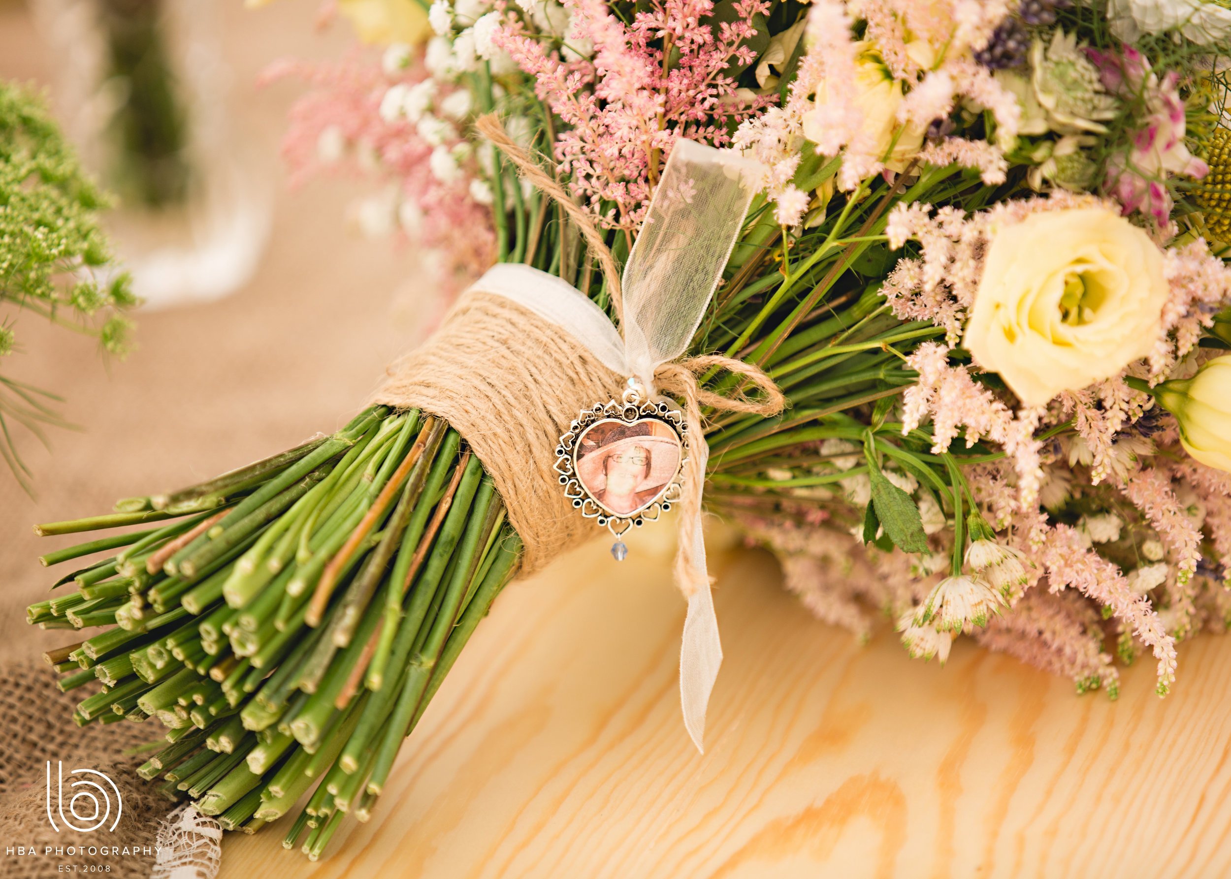 Hand tied bouquet by Tineke complete with sentimental picture for the bride