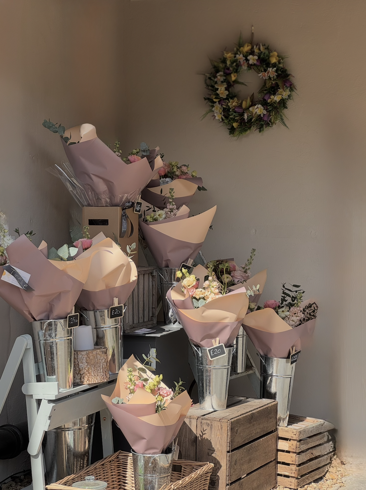Flower bouquets on a stand outside hygieia cafe in mansfield woodhouse from a mansfield woodhouse florist