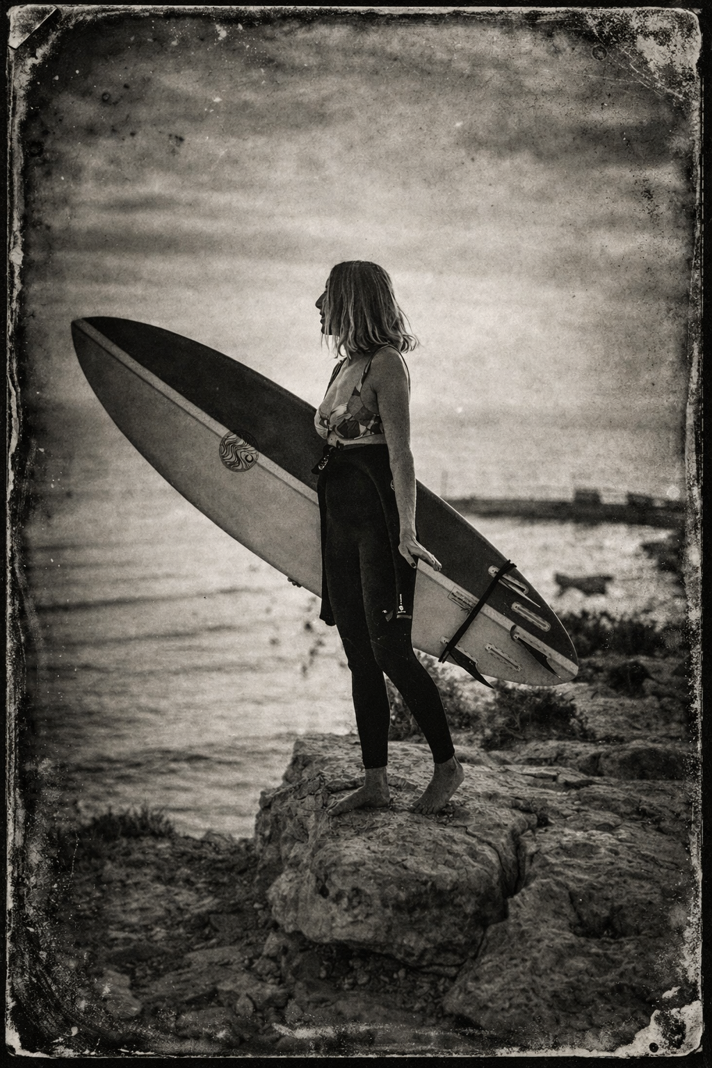 Surfer on a rocky shoreline.png