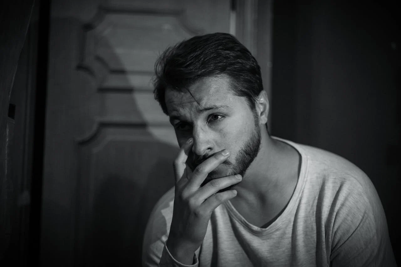 man-holding-his-face