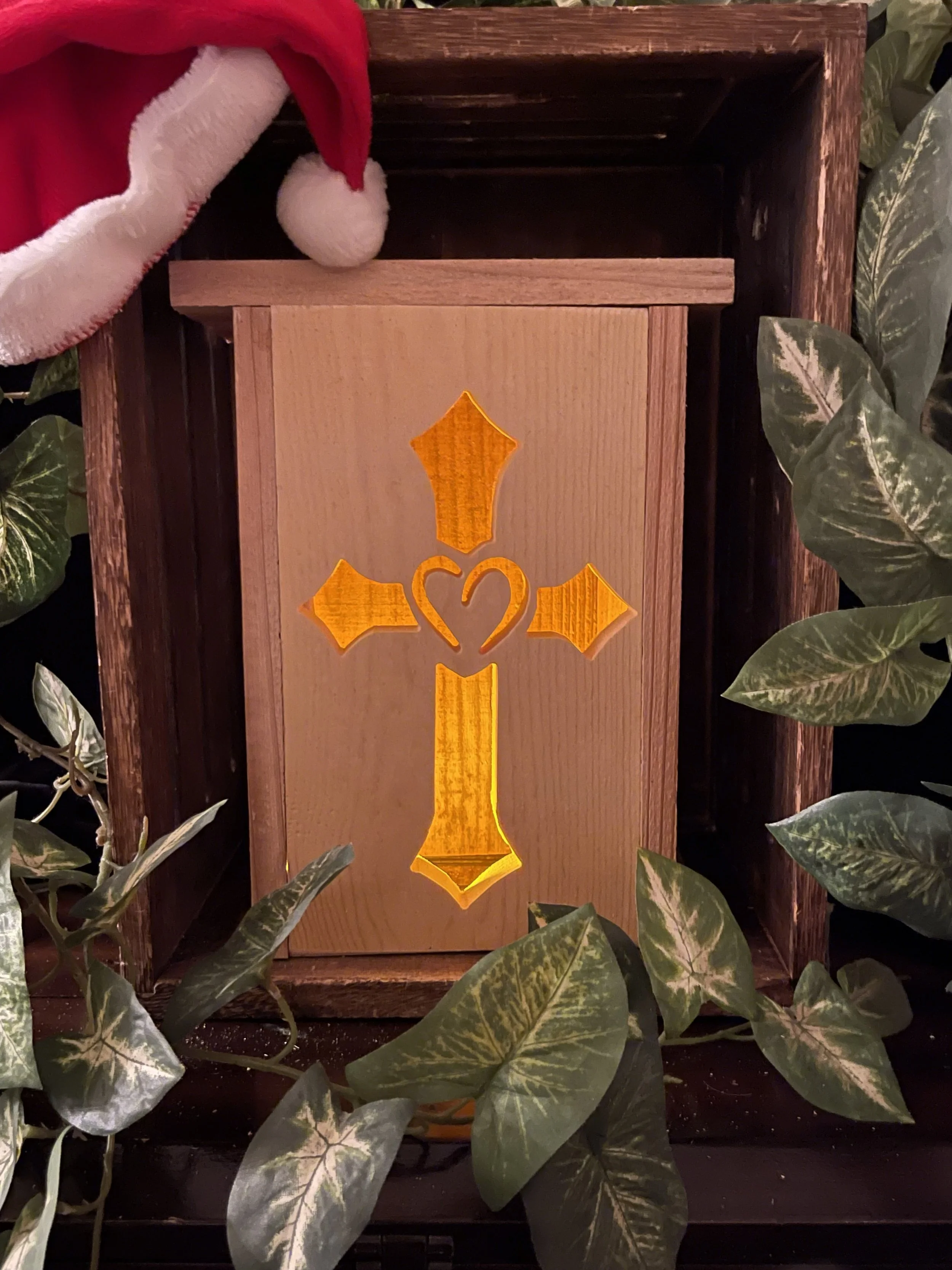 Handcrafted cedar wood Christmas lantern featuring a Heart Cross Silhouette.