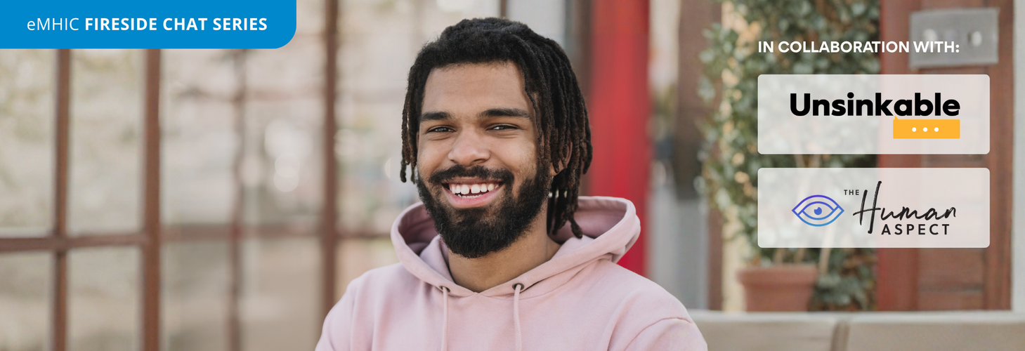 Happy man with dreadlocks smiling, wearing a pink hoodie, in a cozy indoor setting with plants and wooden decor, for a fireside chat series.