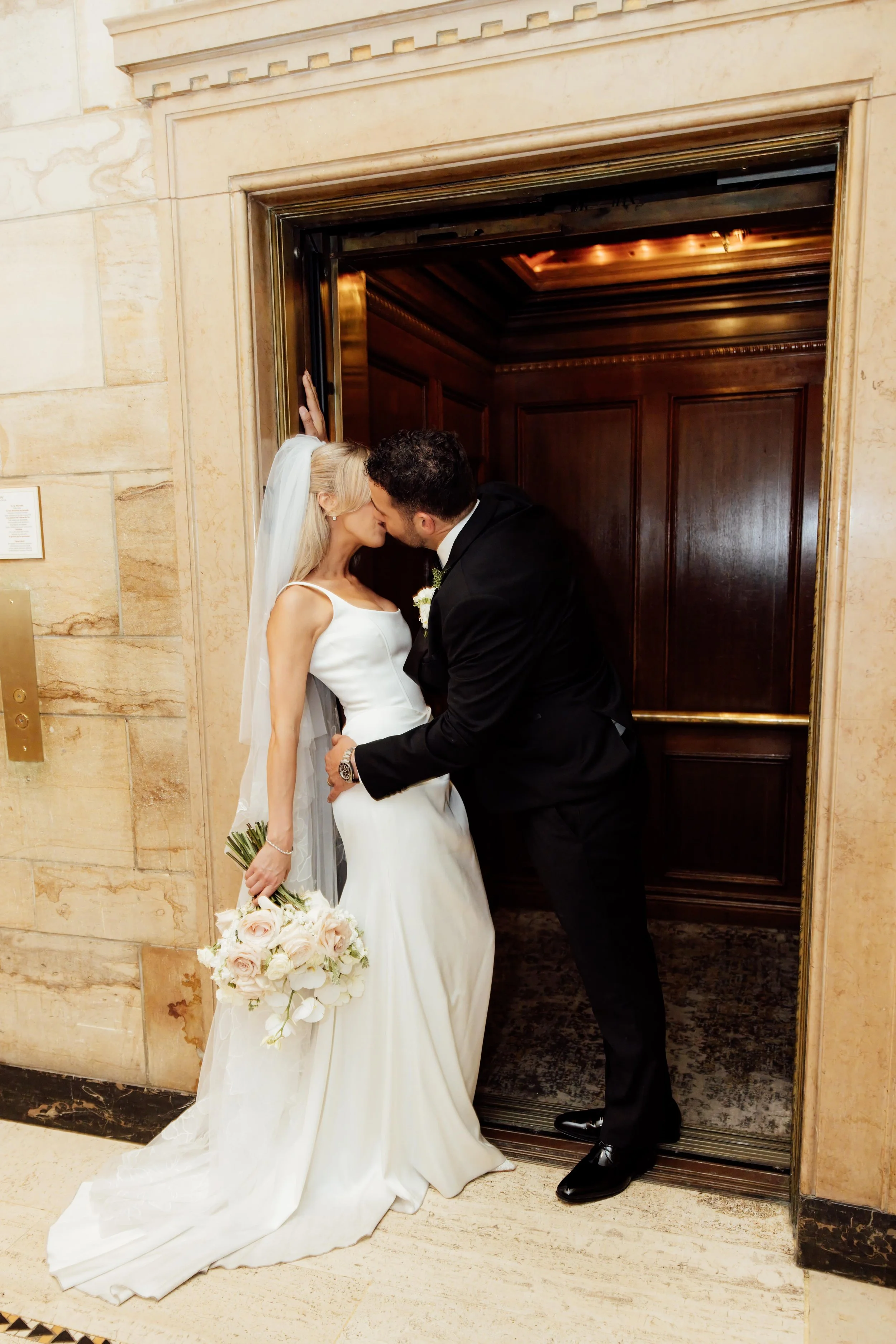 fairmont-chateau-laurier-ottawa-wedding-elevator-kiss.jpg