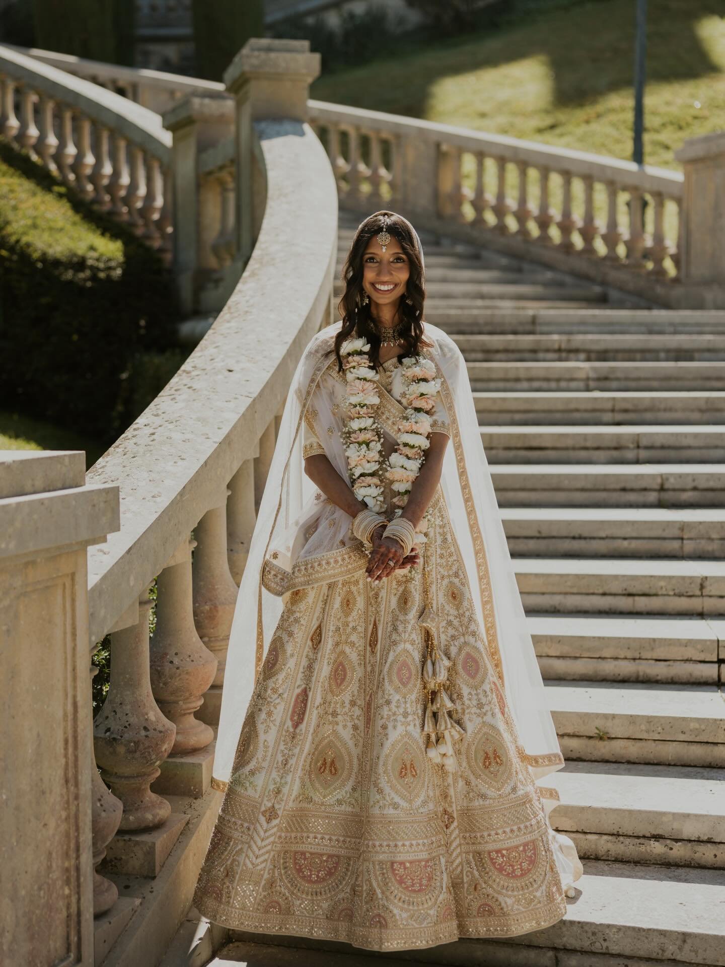 Wrapped in golden elegance and delicate florals - a vision in her embroidered lehenga and blooming garland of love. 
#garlandvibe #indianfusionwedding #brideingold 

@alishasojar @yourweddingwingwoman @briannaritoli @juliacnt @eola.mo @aigal_wedding 