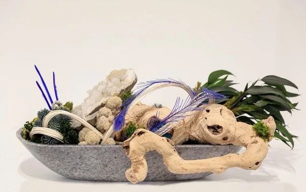 Natural textures. Organic movement. Statement pieces that bring art and nature together.

From crystal accents and preserved botanicals to sculptural driftwood and moss, each arrangement is designed to create a one-of-a-kind focal point.

Available t