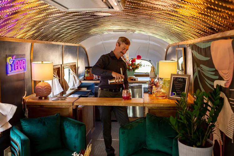 A Stargazer bartender mixing a craft cocktail