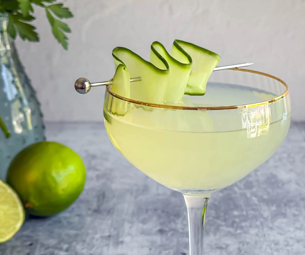 Lime wedges splashing into water with black background