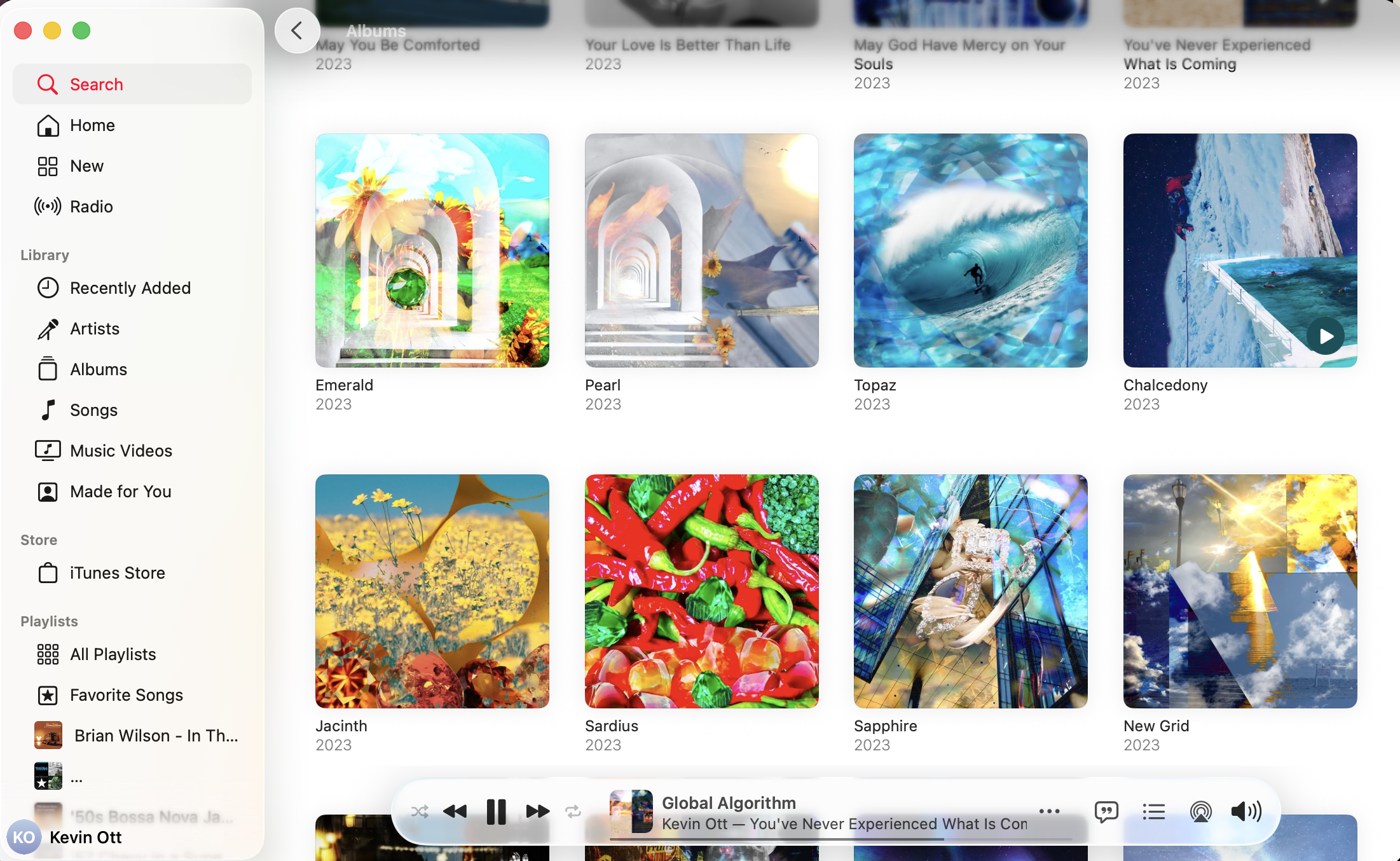 Grid of album colors with a kaleidoscope of colors, images, and album titles and release years in an Apple Music window