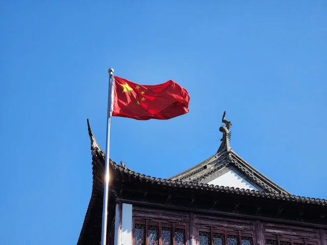 China flag against blue sky
