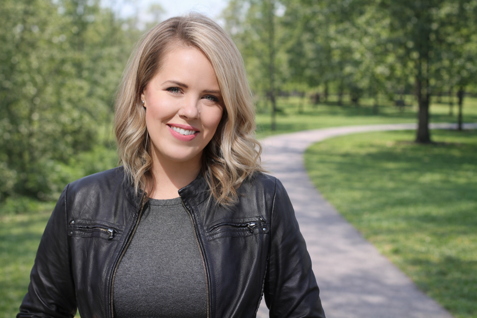 Smiling woman in a sunlit park
