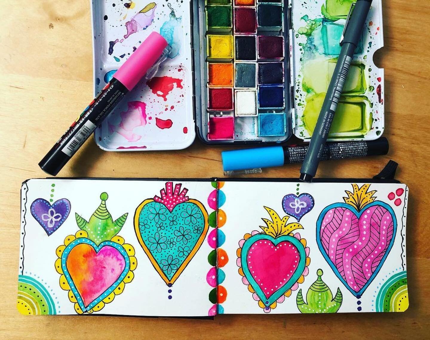 We love these playful Milagro Hearts created by @kcammack88 in our recent Watercolor Reset Challenge!

・・・
Day 3 of the 4 day #wonderfulwatercolorreset challenge. It was fun adding all the detail with the black, white and Posca pens. #smallfieldjourn