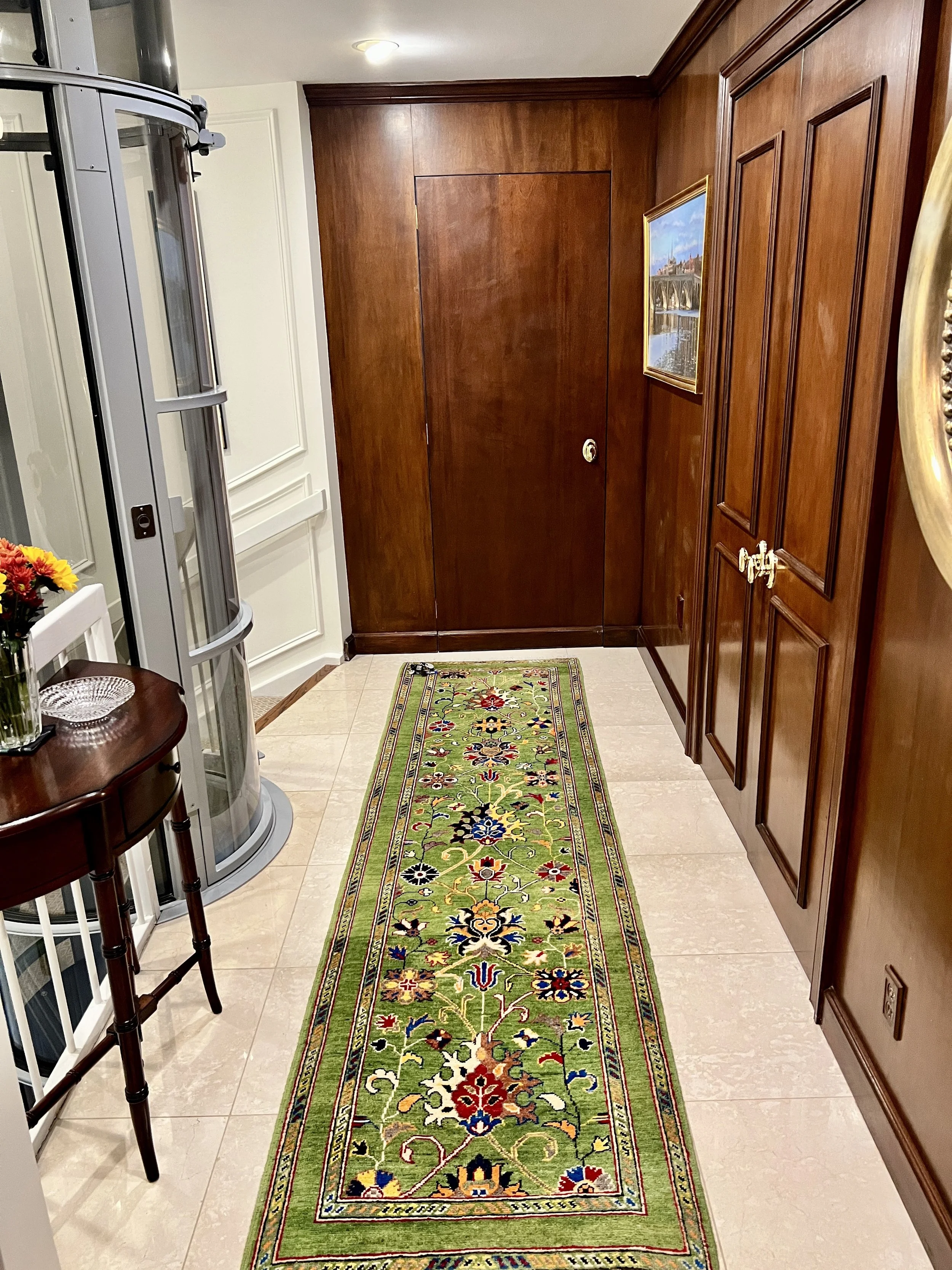 Deciding to keep the original wood paneling we needed to ground and balance the entryway with color and depth. 