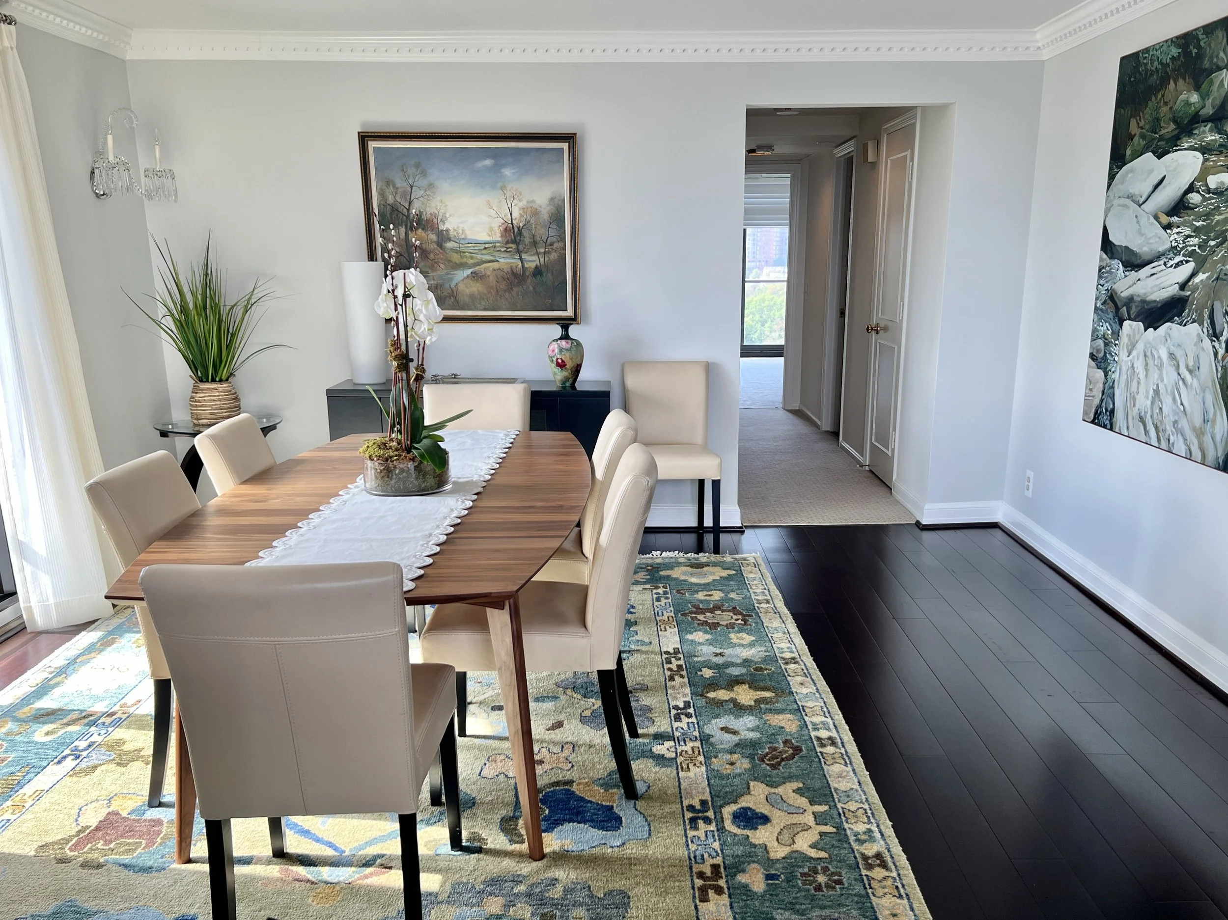 Custom drapery, sun shades, rug selection and table to support their existing art and furnishings.