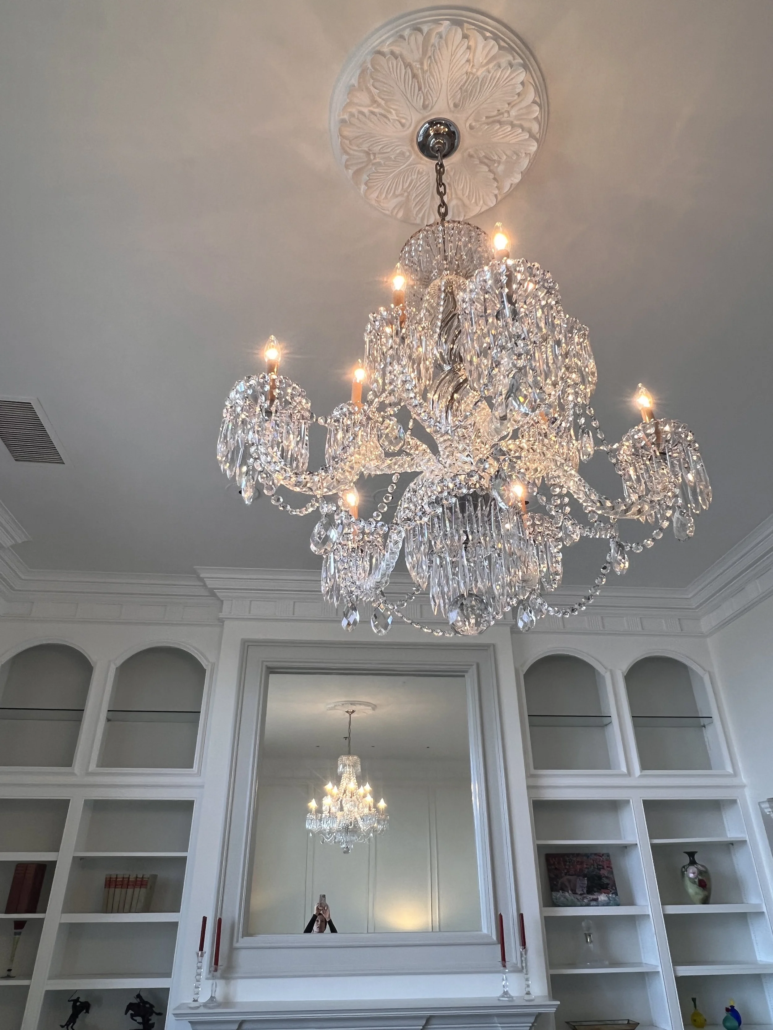 We chose to keep the existing crystal chandelier. It wasn't their first choice, but with the design updates they have fallen in love! 