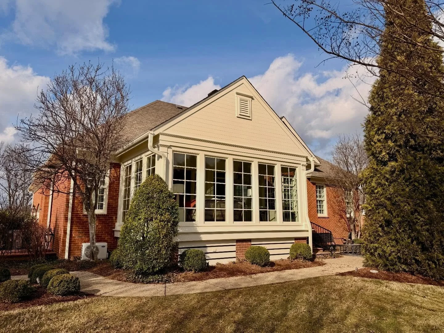 Once a screened porch, now a sunroom that steals the show&mdash;bathed in light, brimming with charm, and destined to be everyone&rsquo;s favorite spot. ☀️ Swipe to see this room before the renovation. 

Builder: Hall &amp; Hall Construction

#archit
