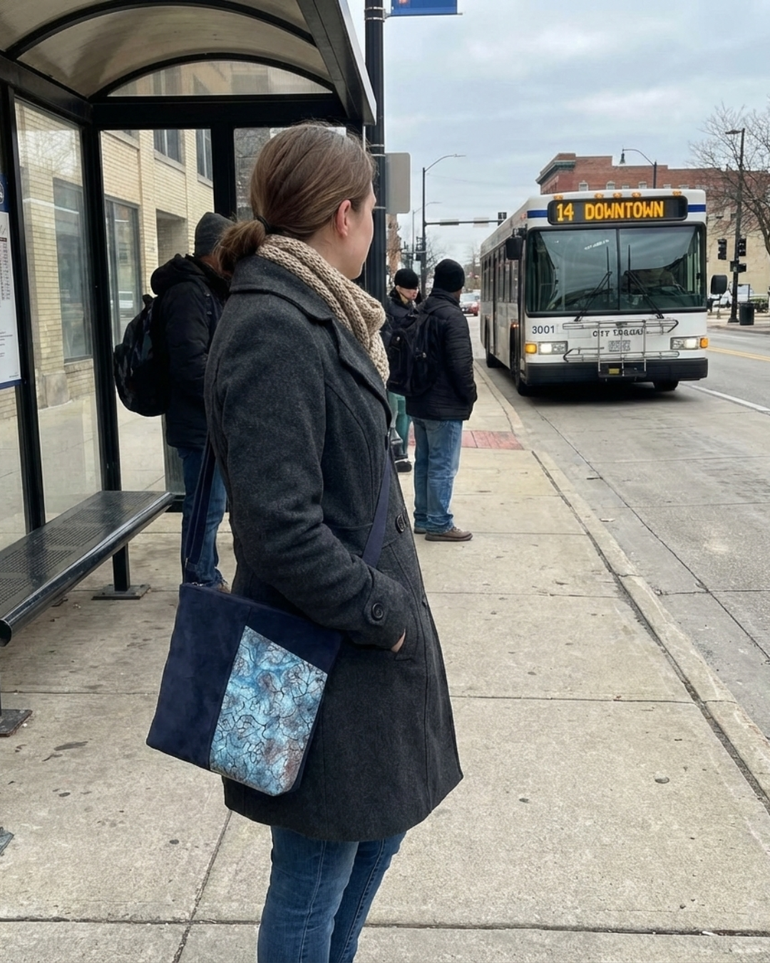 Crossbody purse with front half pocket for cellphone with accent designs