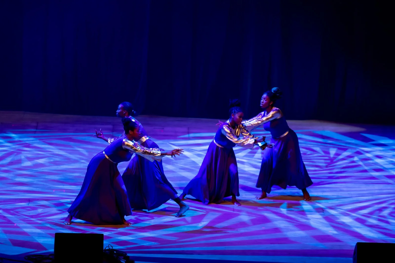 Four dancers from Sankofa Art and Music Foundation.