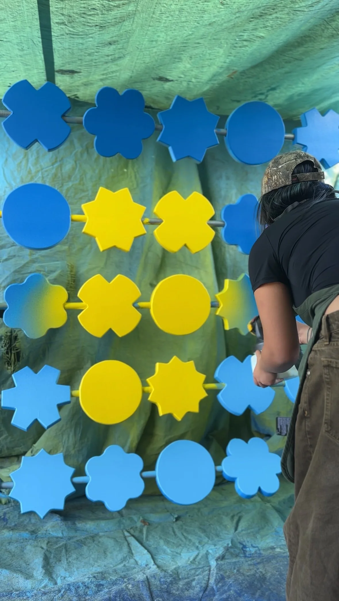 Brend Luong preparing her Blue Sky Arts installation "boundless" – painting final touches.