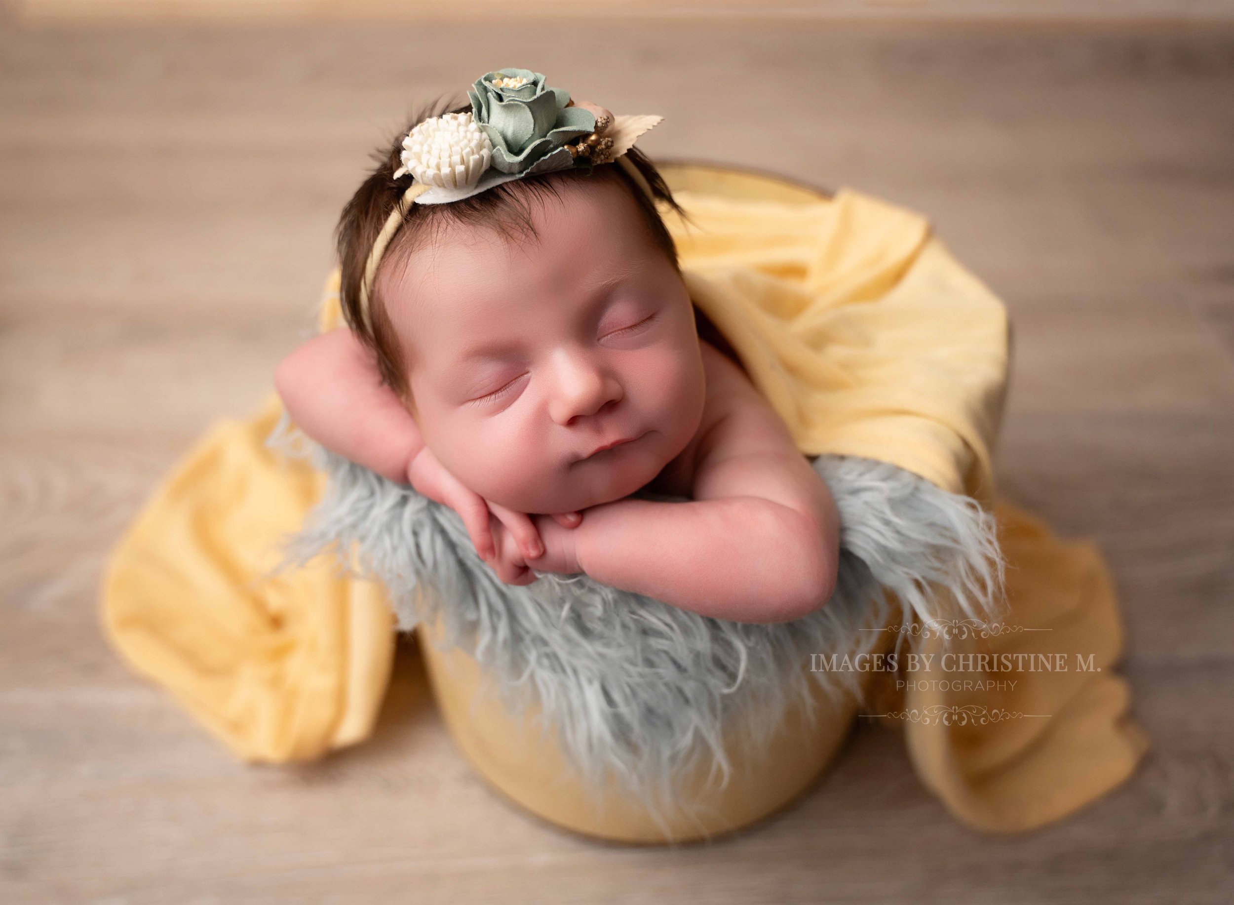 New baby girl in a yellow bucket