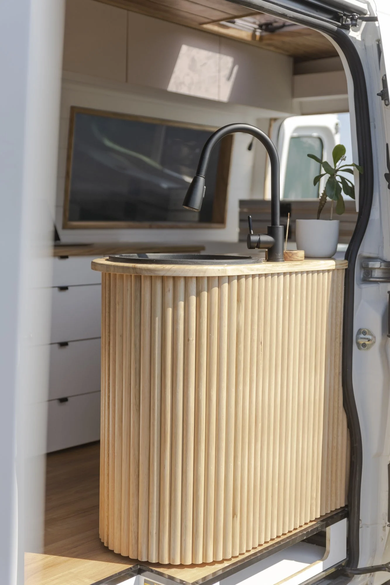 Fluted timber island and black tap