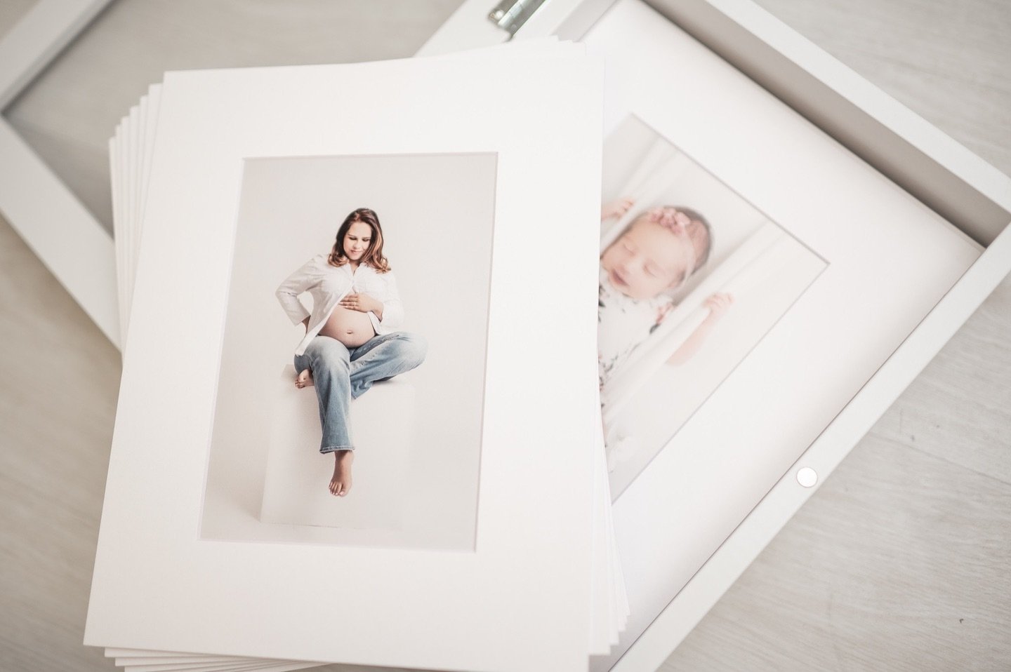 The glass box I offer during maternity and newborn orderings includes up to 15 matted prints. Perfect for your own custom framing. You can even choose to split these between your maternity and newborn sessions. I never recommend printing through drug