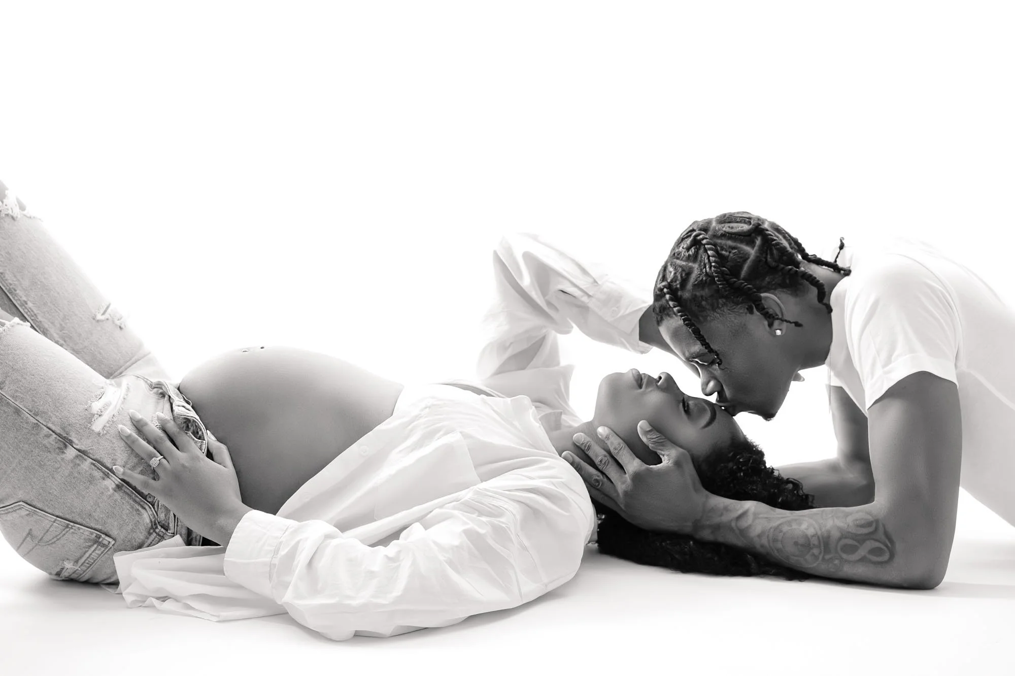 black and white maternity portraits in houston studio with jeans and t shirt