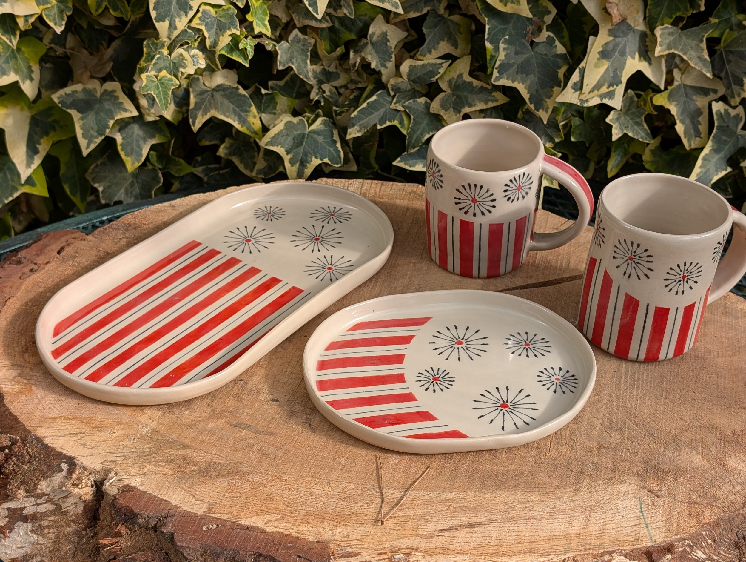 Two red striped trays and two mugs.jpg