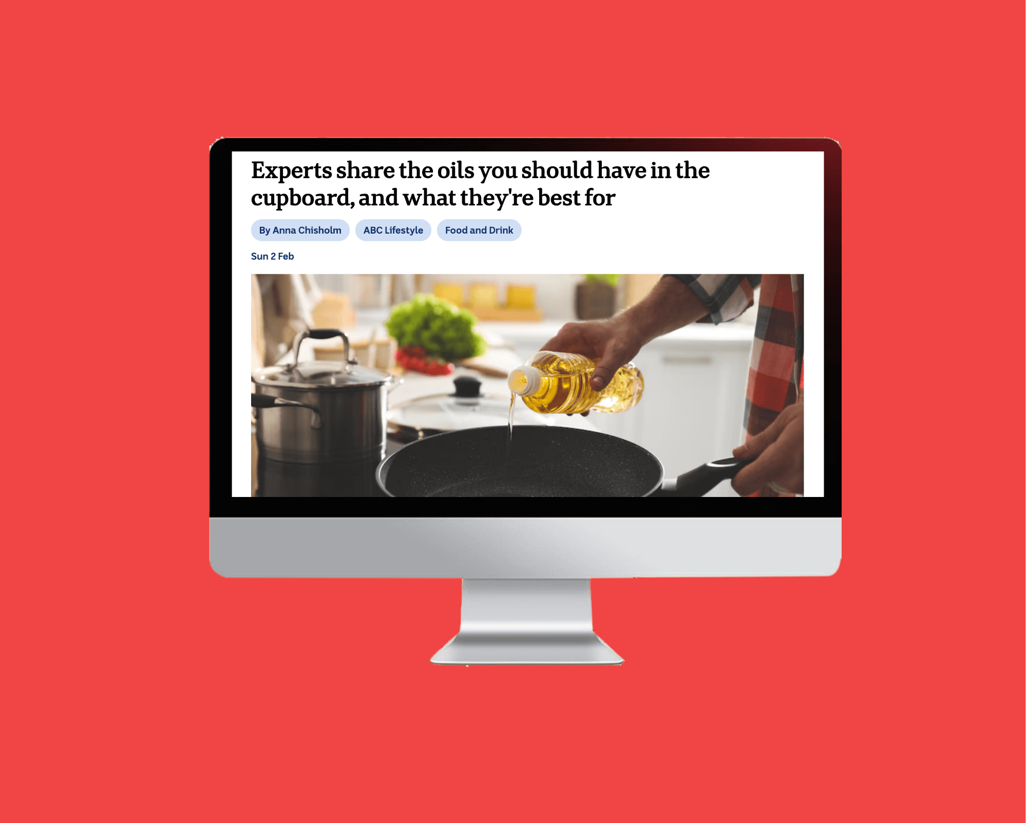 News article on computer screen best oils to cook with on red tile background