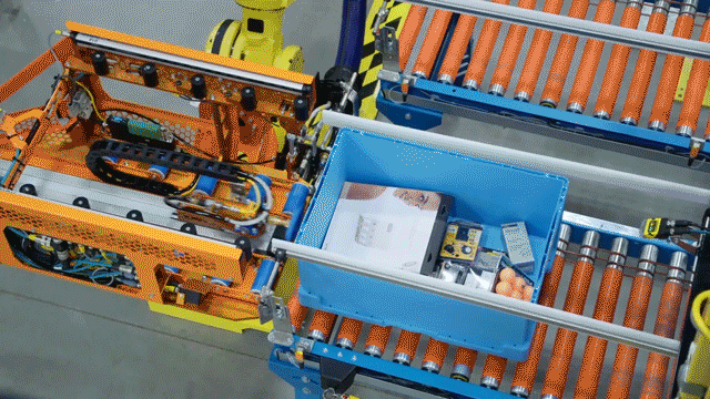 Watch Amazon's newest robot stowing products onto mobile shelving units