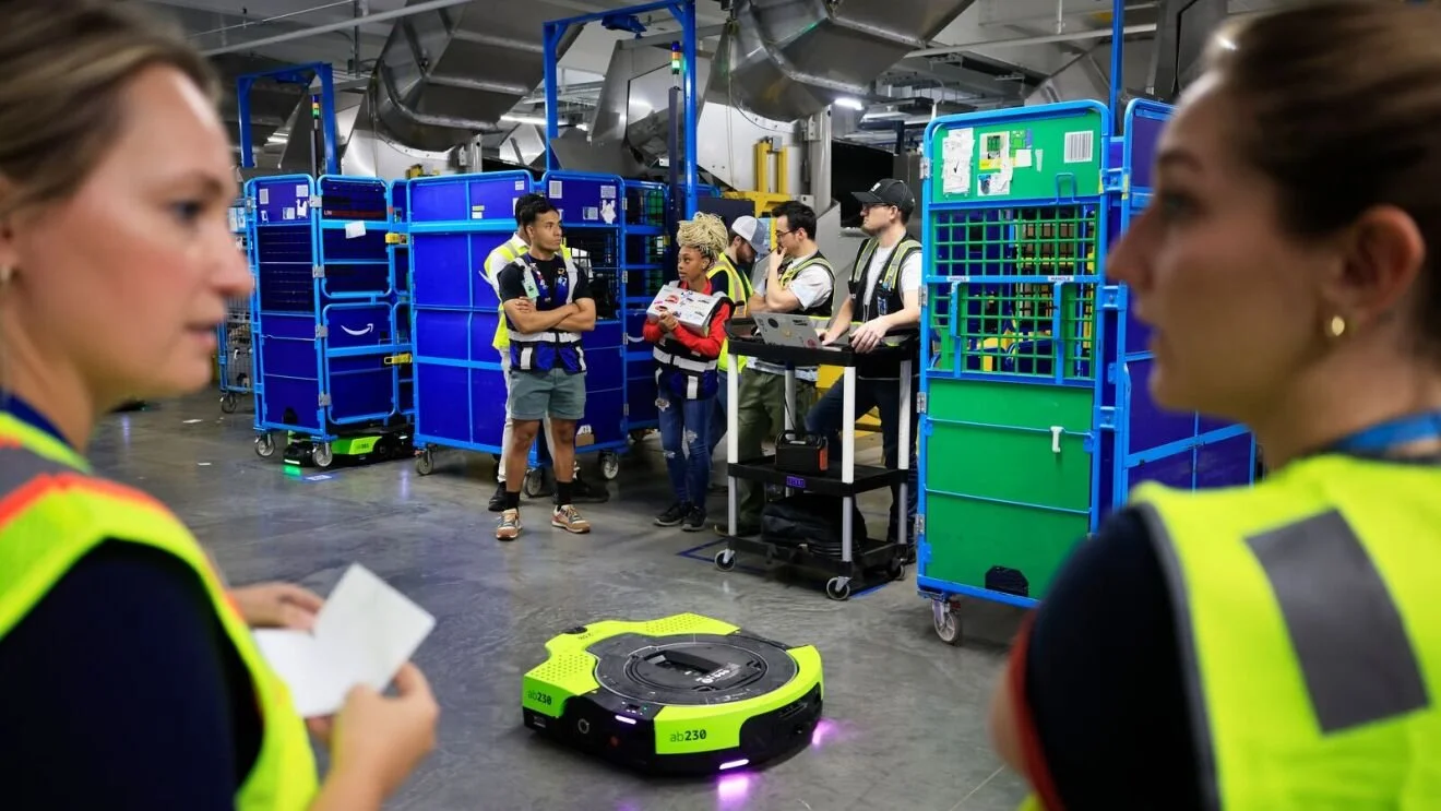  The next-generation Proteus robot can now operate anywhere across Amazon fulfillment sites, taking direction from employees through conversational prompts. 