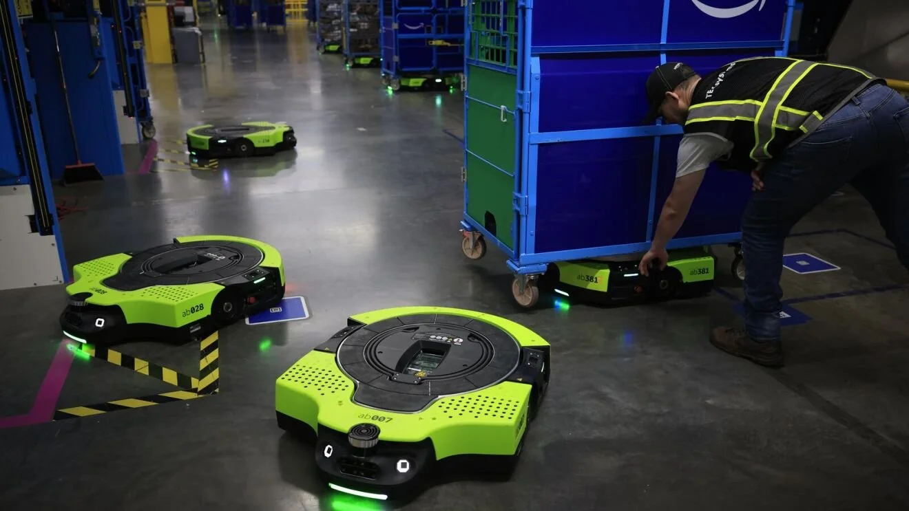  Amazon's Proteus robot handles heavy lifting to support safety at a fulfillment center. 