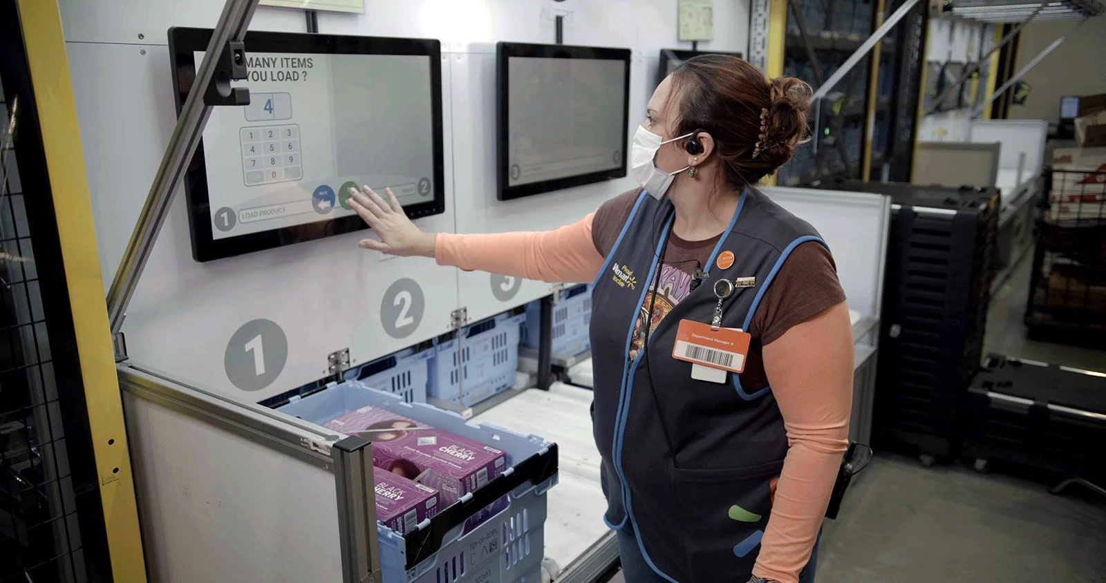 walmart-associate-interacting-with-screen-in-a-local-fulfillment-center.jpg