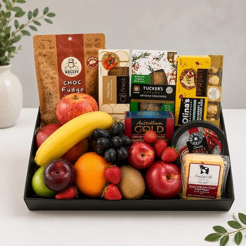 Fruit hamper with a selection of seasonal fruit, cheese, dip, crackers, gourmet fudge and ferrero rochers.