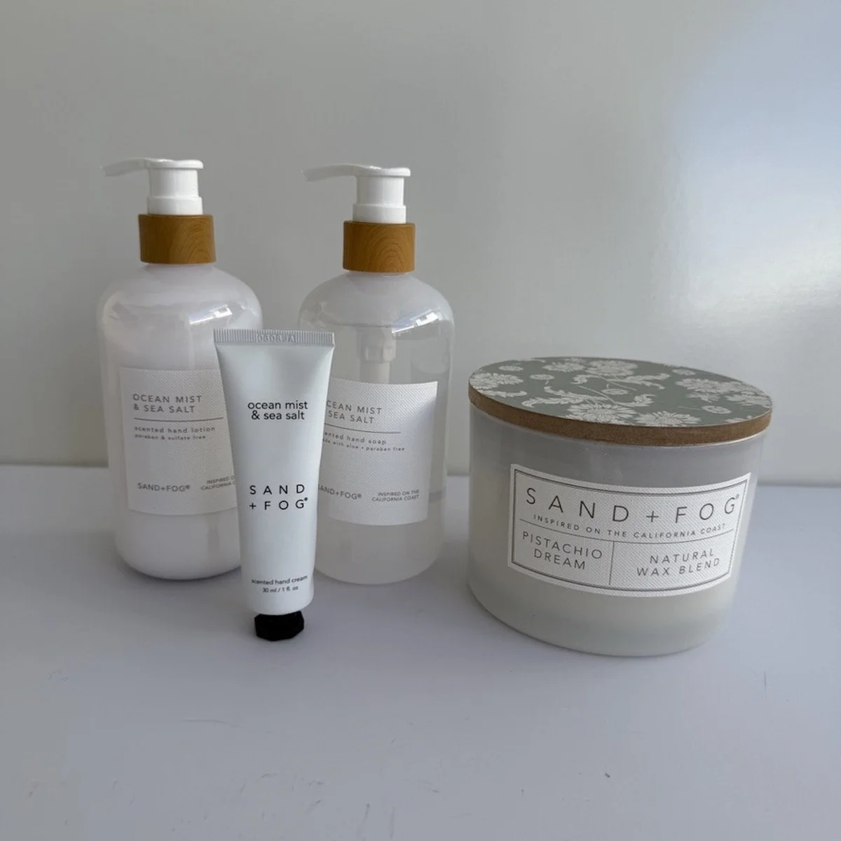 Sand and fog Ocean mist Hand wash, hand cream, Hand lotion and 55 hours burn candle. Hamper also includes chocolates, body wash and washer and purse perfume.