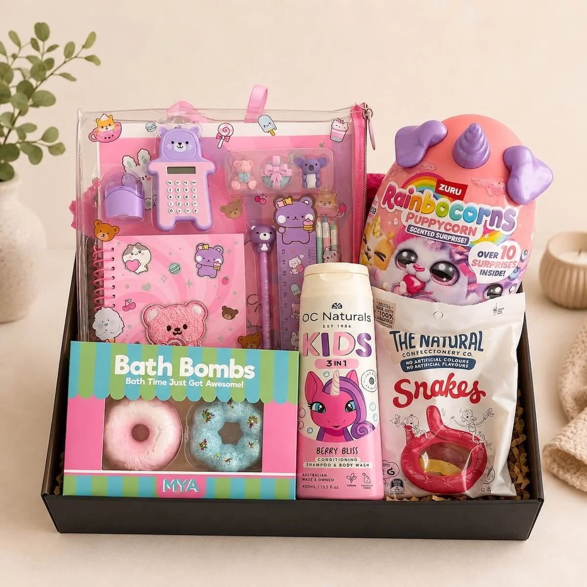 Rainbocorns & Pamper Hamper for girls aged 3+. Includes Zuru Puppycorn, activity pack, OC Naturals wash, bath bombs and snake lollies. Great gift idea.