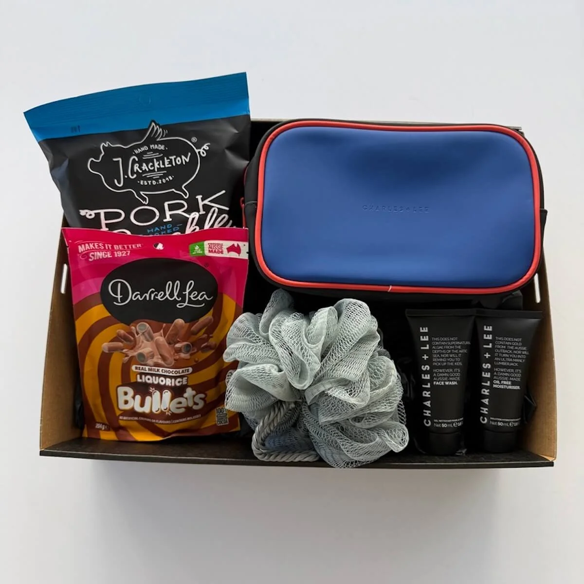 The Everyday Man Gift Hamper with toiletry bag, Charles + Lee face wash and moisturiser, body wash, liquorice bullets and pork crackles – free same-day Gold Coast delivery