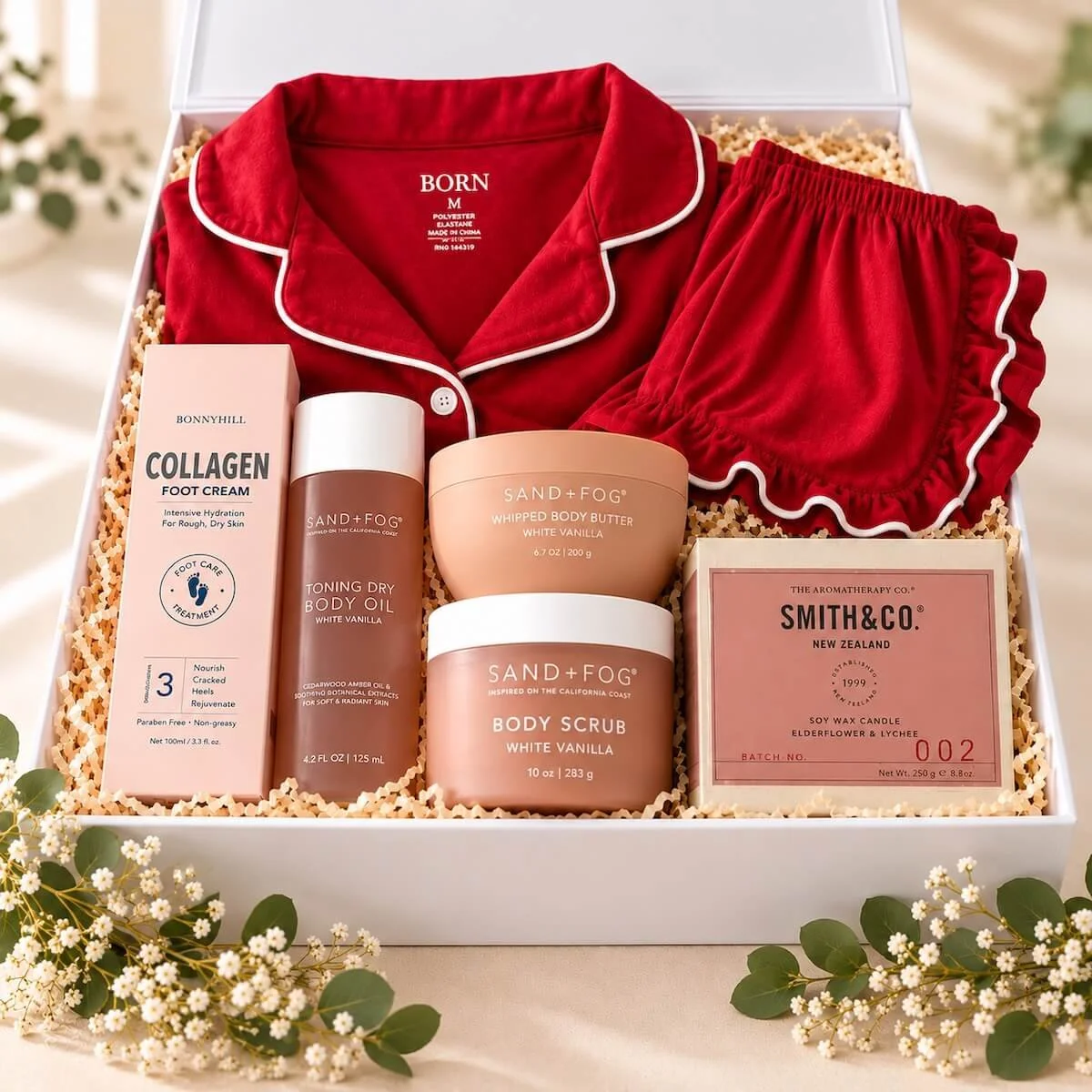 Luxury pamper gift box featuring red Born pyjamas, chocolates and pampering treats, beautifully presented for gifting on the Gold Coast.