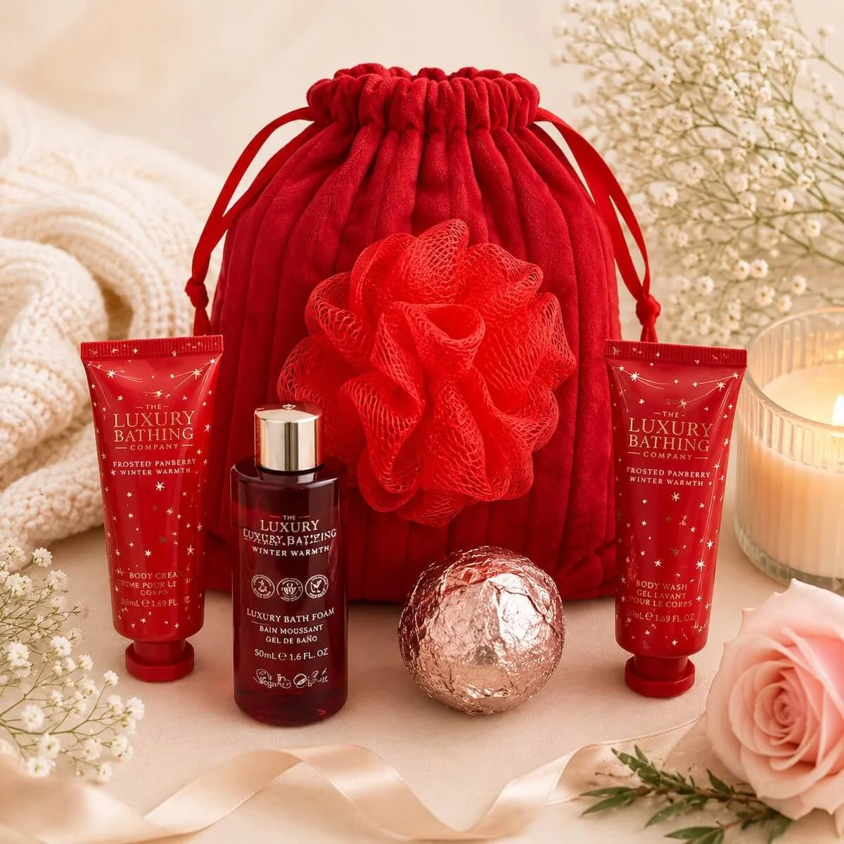 Pack of luxury pamper products for the Bed and Bubbles Hamper, including hand cream, body wash, bath bomb, body cream, and mesh washer