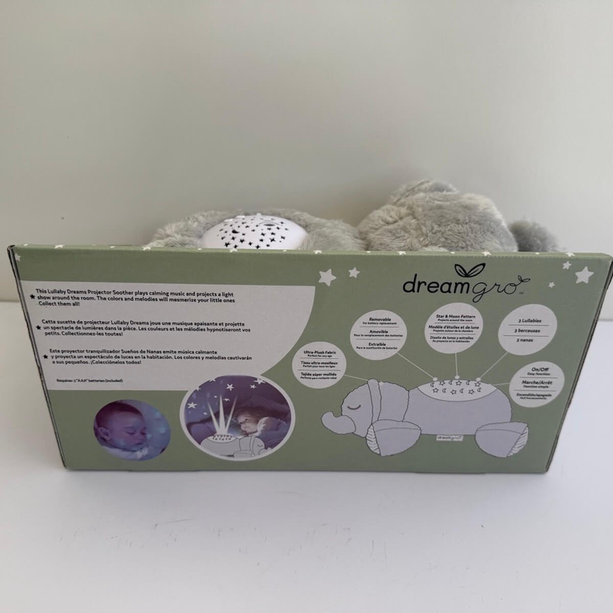 Back of the Dream Gro projector soother box showing product features, including soothing lullaby music, gentle multicoloured projection lights, operating instructions and product information.