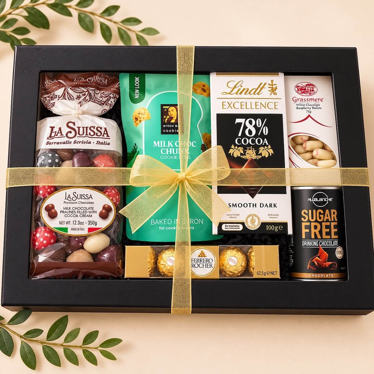 Premium chocolate gift box filled with Lindt, Ferrero Rocher, pralines, cookies and sugar-free drinking chocolate, finished with ribbons and bows for delivery Gold Coast.