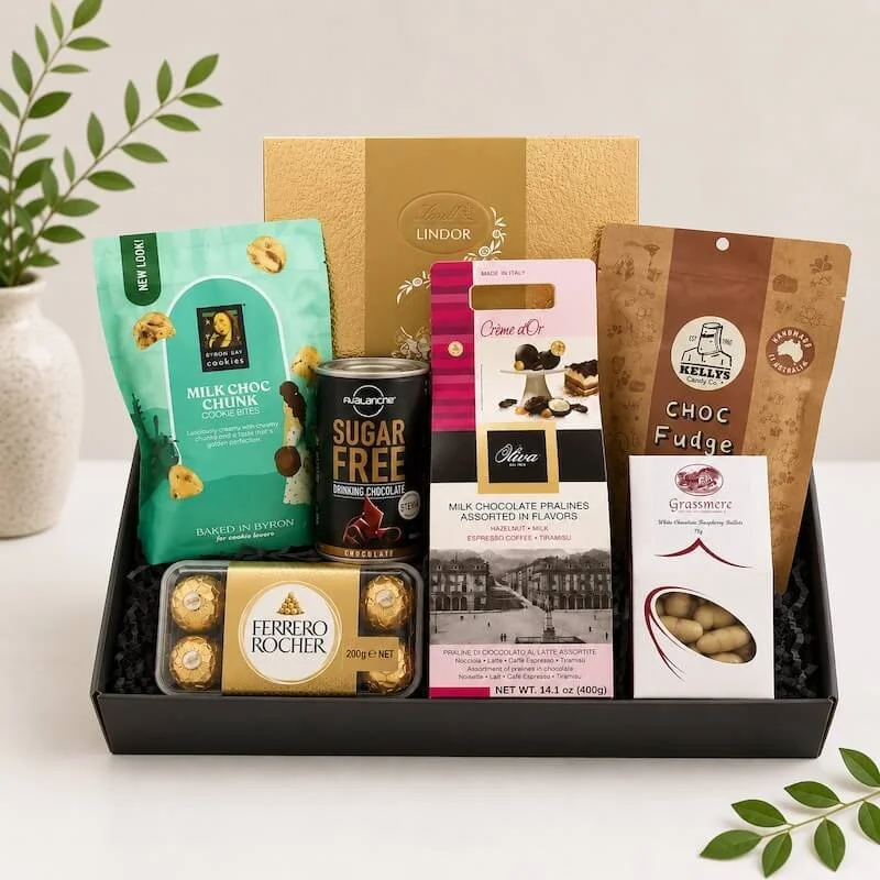 A Chocolate hamper with a assortement of quality chocolate treats. Includes Lindt, Ferrero Rochers, Italian chocolates, kellys fudge, byron bay cookies, chocolate drink and white chocolate raspberry bullets.
