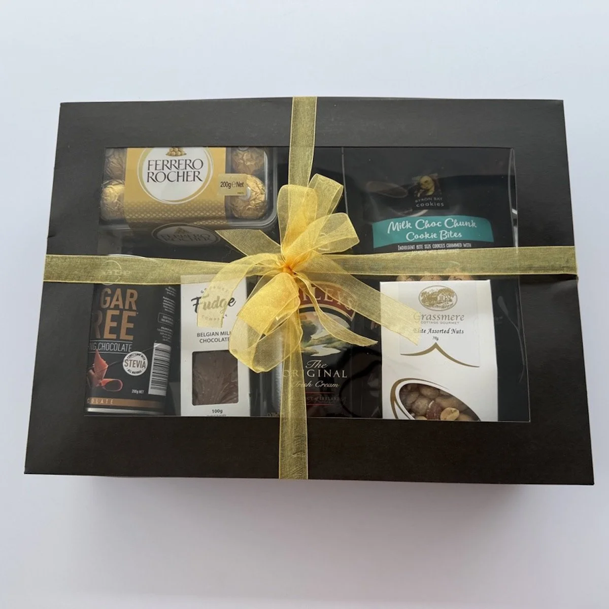 Gift box with baileys Irish cream, Ferrero Rocher's, Gourmet nuts, fudge, cookies, and chocolate drink in a luxury gift box.