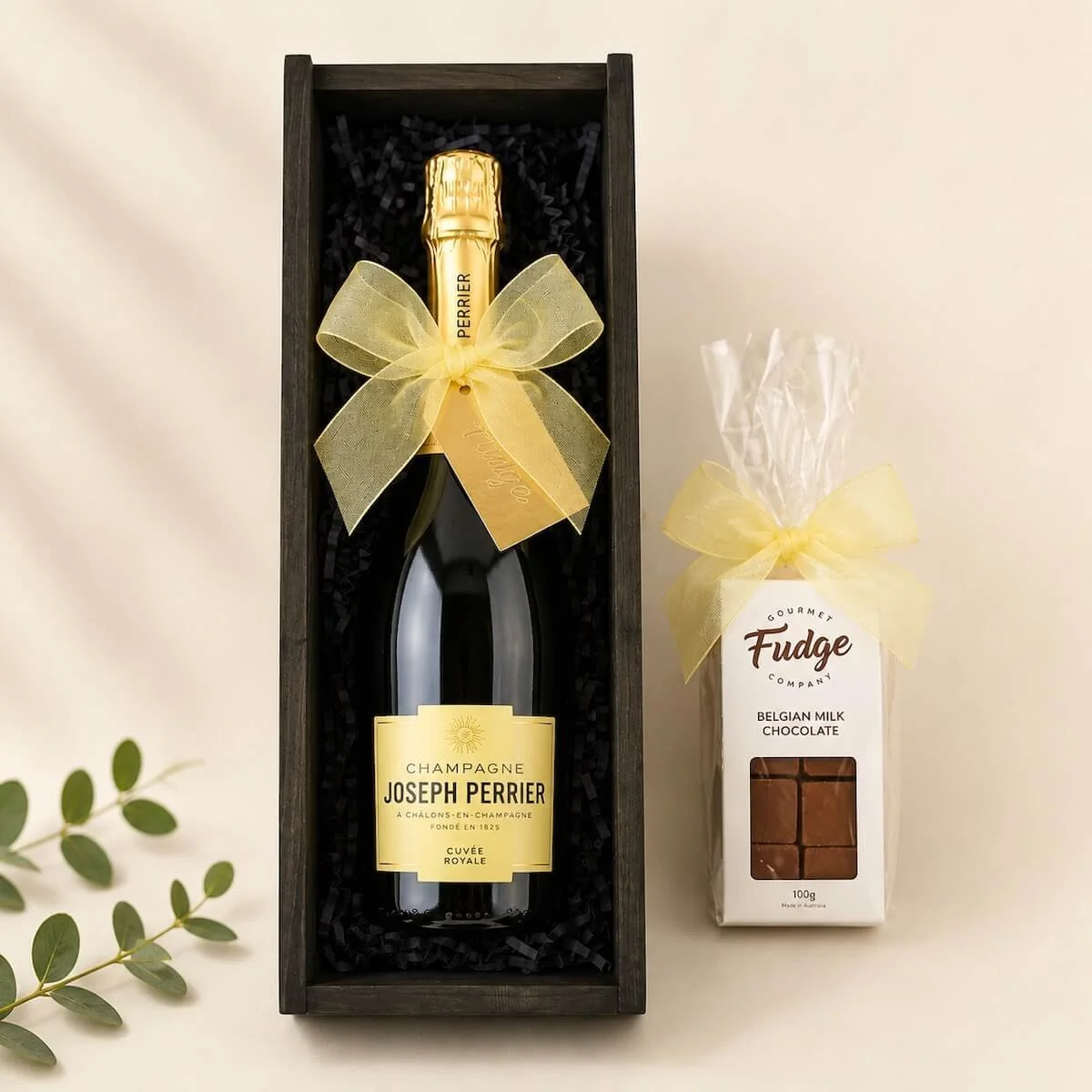 Wooden wine box gift with Joseph Perrier Champagne and a 100g pack of gourmet fudge gift wrapped with ribbons gold coast delivery.